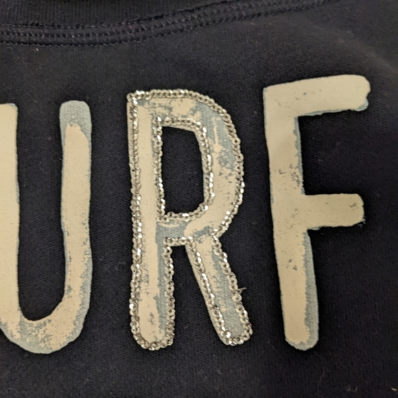 Hollister Surf On Black w/Glitter Pullover Size XS NEW - Picture 2 of 2